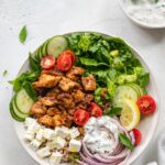 Chicken shawarma protein bowl with tzatziki, vegetables, and rice