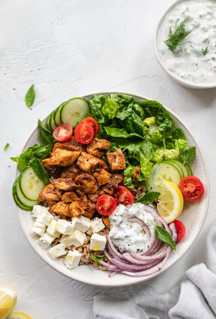 Chicken shawarma protein bowl with tzatziki, vegetables, and rice